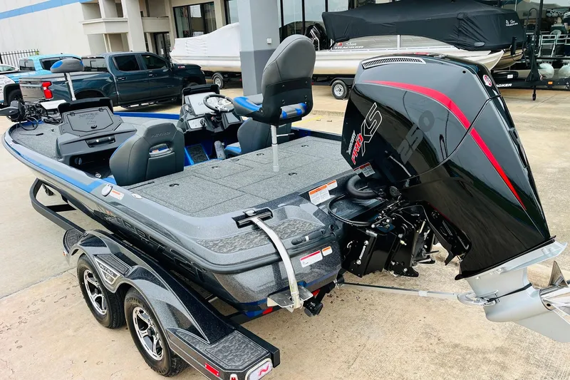 Slide: The Image of 2026 Nitro Z21 XL Pro boat with powerful outboard motor, parked on a trailer. - 66