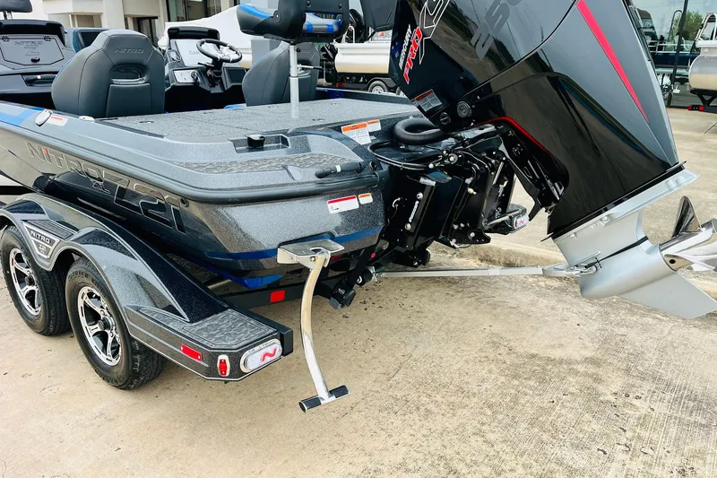 Slide: The Image of 2026 Nitro Z21 XL Pro boat with powerful outboard motor on trailer. - 67