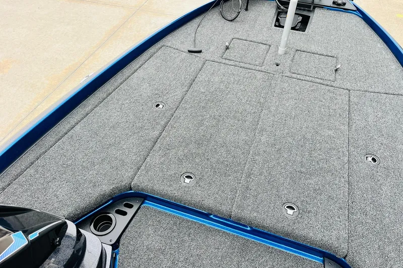 Slide: The Image of 2026 Nitro Z21 XL Pro boat deck with gray carpet and storage compartments. - 73
