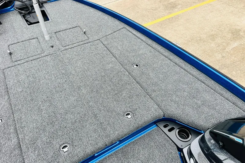 Slide: The Image of 2026 Nitro Z21 XL Pro boat deck with gray carpet and storage compartments. - 74