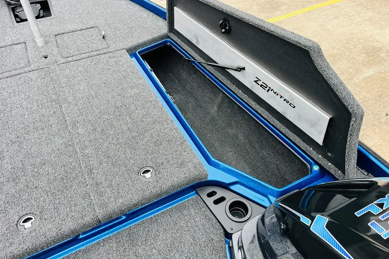 Slide: The Image of 2026 Nitro Z21 XL Pro boat storage compartment with open lid, showcasing interior design. - 77
