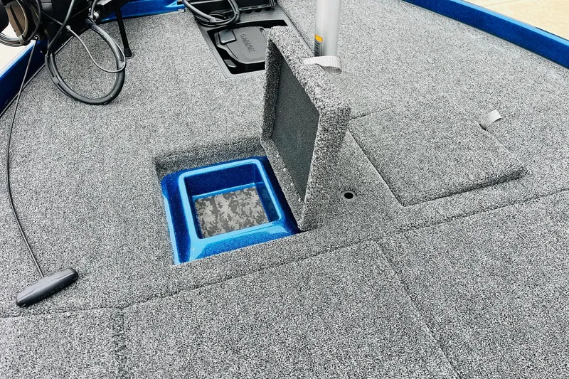 Slide: The Image of 2026 Nitro Z21 XL Pro boat deck with storage compartments and carpeted finish. - 79