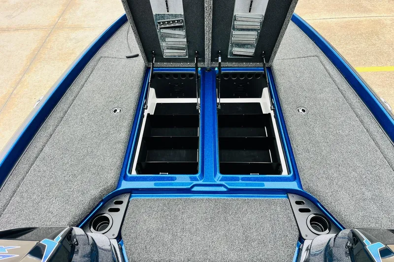 Slide: The Image of 2026 Nitro Z21 XL Pro boat with open storage compartments, blue and gray interior. - 85