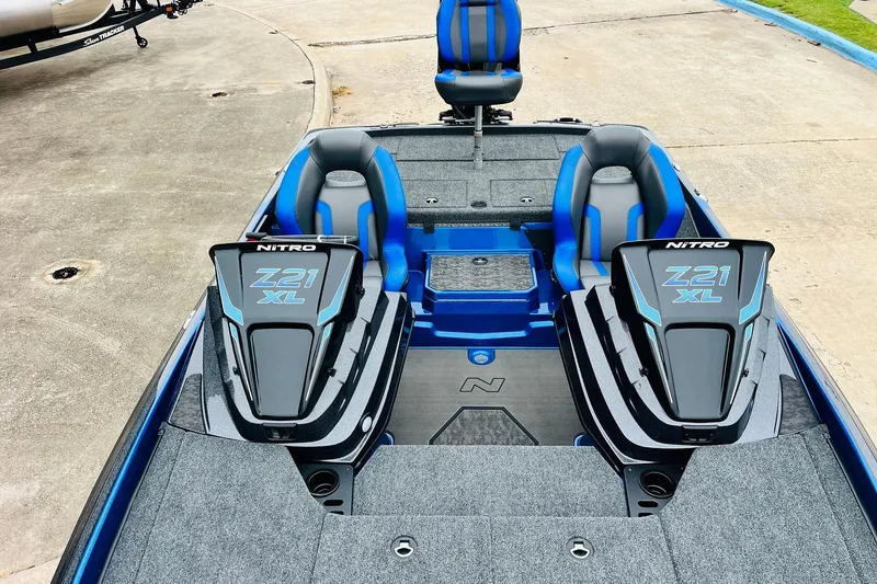 Slide: The Image of 2026 Nitro Z21 XL Pro boat interior with blue and gray seating, showcasing modern design. - 90