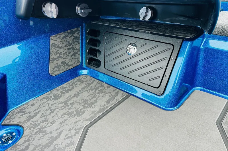 Slide: The Image of 2026 Nitro Z21 XL Pro boat interior with blue metallic finish and storage compartment. - 96