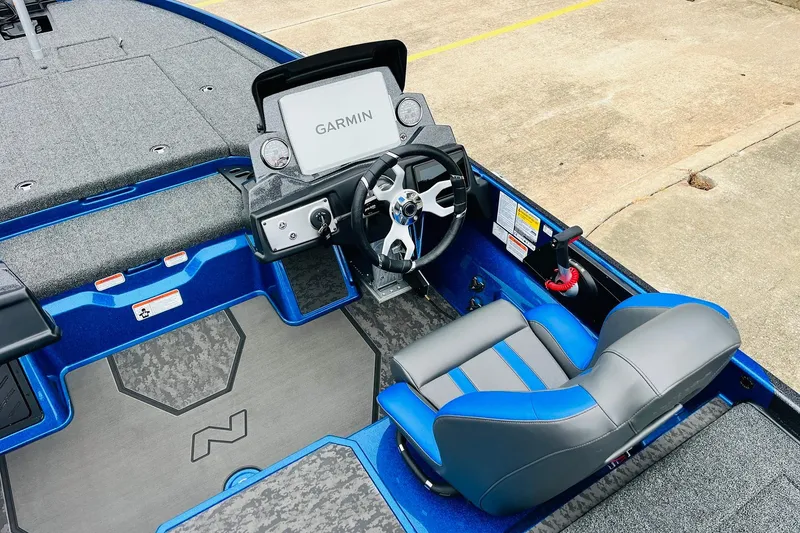 Slide: The Image of 2026 Nitro Z21 XL Pro boat interior with Garmin display and blue-gray seating. - 98