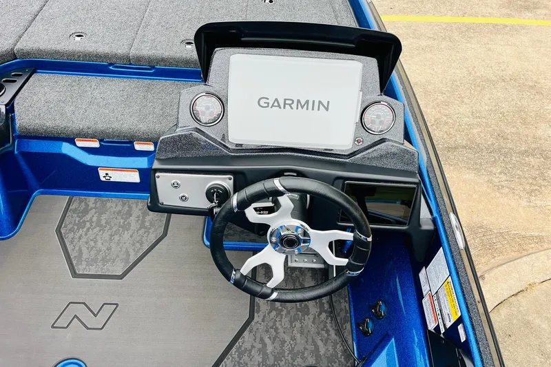 Slide: The Image of 2026 Nitro Z21 XL Pro boat dashboard with Garmin display and steering wheel. - 99