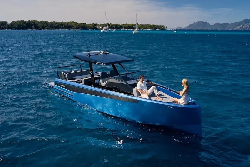 The Image of 2026 Virtue V10 T-Top boat cruising on blue ocean with two people relaxing onboard. - 0