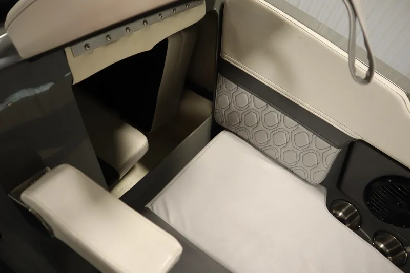 Slide: The Image of 2022 Heyday H22 boat interior with cushioned seating and cup holders. - 15