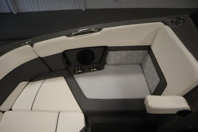 Slide: The Image of 2022 Heyday H22 boat interior with cushioned seating and cup holders. - 17