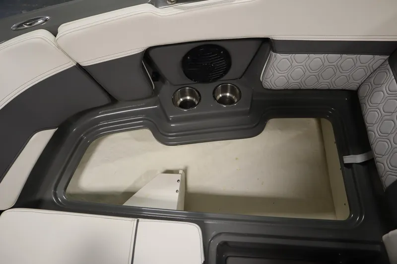 Slide: The Image of 2022 Heyday H22 boat interior with cup holders and cushioned seating. - 18