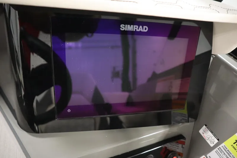 Slide: The Image of Simrad display on 2022 Heyday H22 boat dashboard, featuring modern navigation technology. - 22