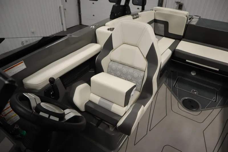 Slide: The Image of Interior of 2022 Heyday H22 boat with modern seating and steering wheel. - 27