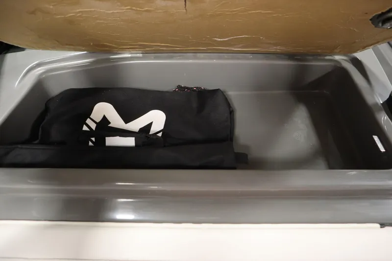 Slide: The Image of Storage compartment in 2022 Heyday H22 boat with a black bag inside. - 30
