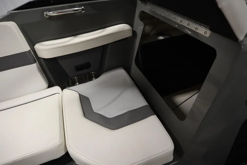 Slide: The Image of 2022 Heyday H22 boat interior with cushioned seating and storage compartment. - 31