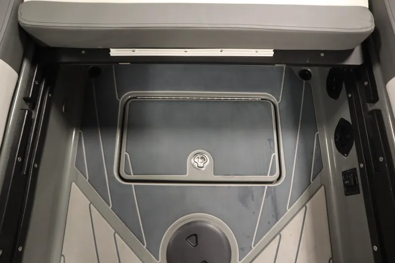 Slide: The Image of 2022 Heyday H22 boat interior with storage compartment and seating area. - 37