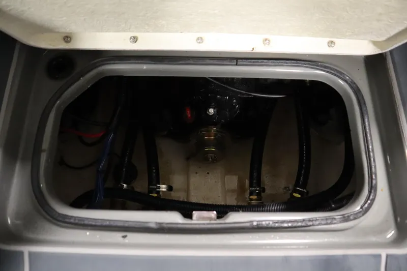 Slide: The Image of 2022 Heyday H22 boat engine compartment with visible hoses and components. - 38