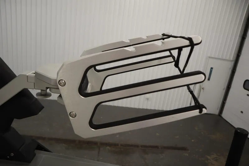 Slide: The Image of Heyday H22 2022 boat accessory, metal rack with black straps in a garage setting. - 44