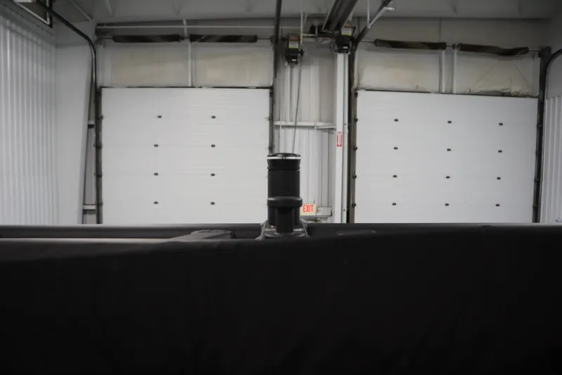 Slide: The Image of 2022 Heyday H22 boat in a garage with closed white doors. - 45