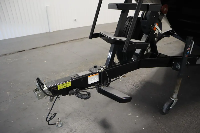 Slide: The Image of Trailer hitch of a 2022 Heyday H22 boat in a garage setting. - 51