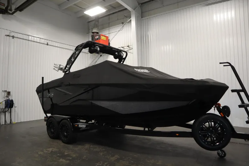 Slide: The Image of 2022 Heyday H22 boat with cover on trailer in indoor storage. - 56