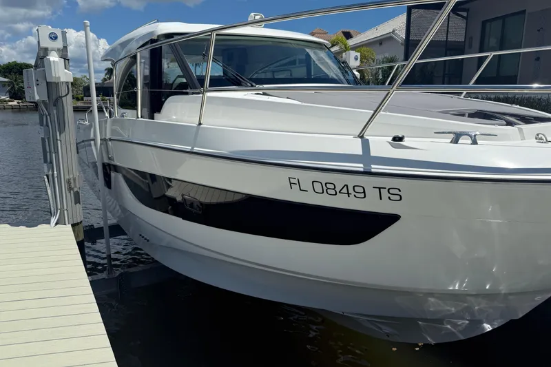 Slide: The Image of 2024 Beneteau Antares 11 docked, showcasing sleek design and modern features. - 2