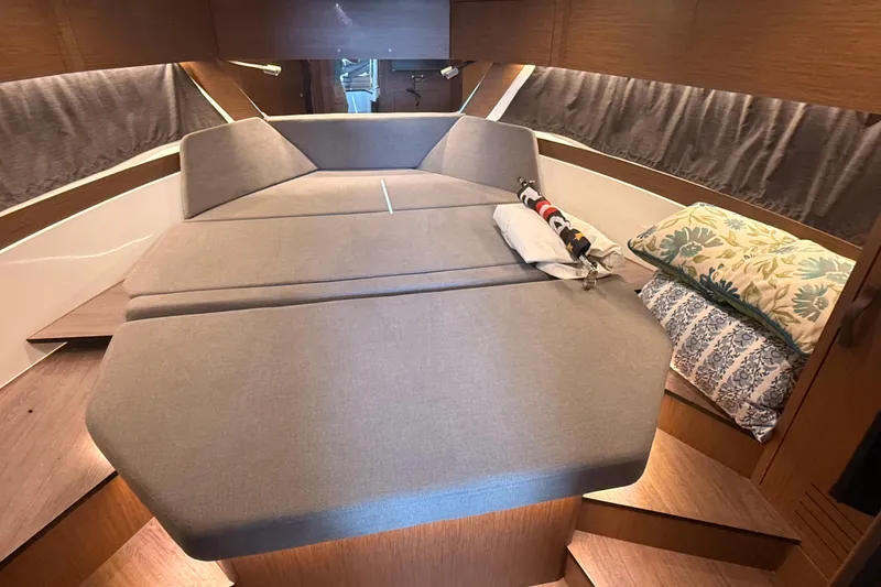 Slide: The Image of Luxurious cabin interior of 2024 Beneteau Antares 11 with cozy bedding and modern design. - 24