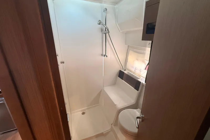 Slide: The Image of 2024 Beneteau Antares 11 bathroom with shower, toilet, and modern fixtures. - 25