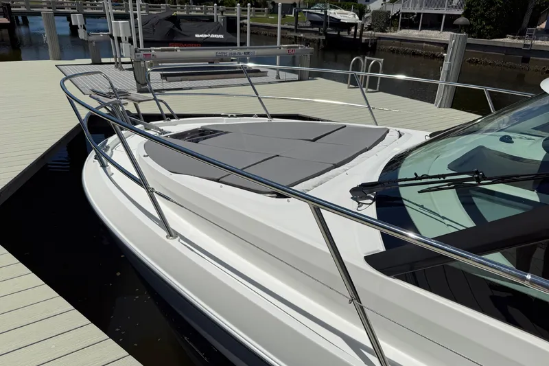 Slide: The Image of 2024 Beneteau Antares 11 docked, showcasing sleek design and spacious deck area. - 3