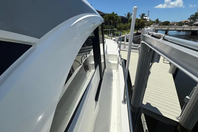 Slide: The Image of 2024 Beneteau Antares 11 yacht docked, showcasing sleek design and modern features. - 7