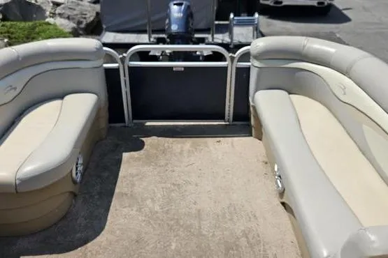 Slide: The Image of 2013 Bennington 20SLX pontoon boat interior with beige seating and open deck space. - 10