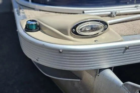 Slide: The Image of 2013 Bennington 20SLX boat bow with navigation light and sleek design. - 14