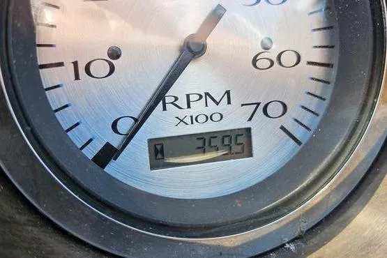 Slide: The Image of Close-up of a 2013 Bennington 20SLX RPM gauge displaying 3595 RPM. - 7