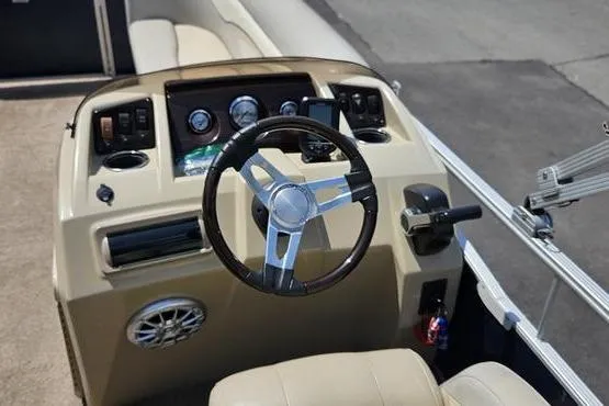 Slide: The Image of 2013 Bennington 20SLX boat dashboard with steering wheel and control panel. - 8