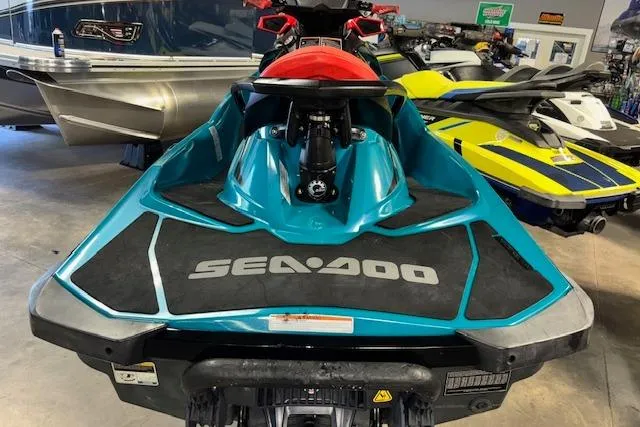 Slide: The Image of 2018 Sea-Doo Wake 155 jet ski in showroom, rear view. - 16