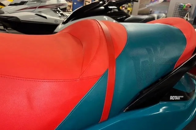Slide: The Image of 2018 Sea-Doo Wake 155 jet ski seat in vibrant red and teal colors. - 6