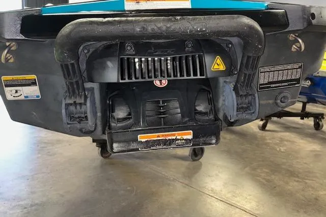 Slide: The Image of 2018 Sea-Doo Wake 155 rear view, showcasing jet propulsion system and warning labels. - 8