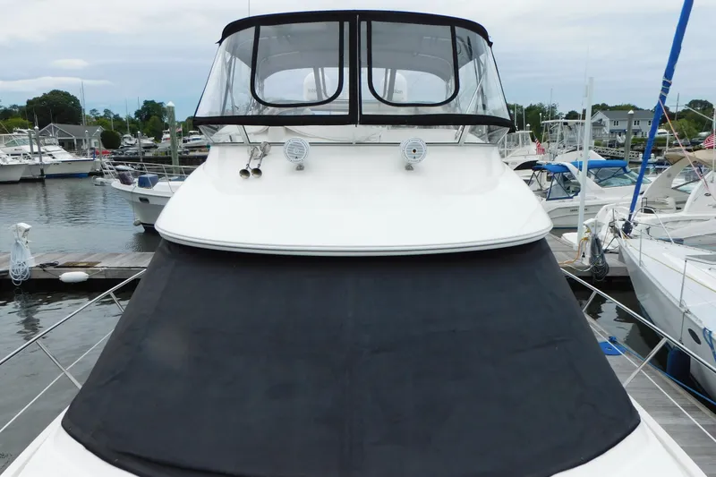 Slide: The Image of 2009 Meridian 391 Sedan yacht docked at marina, front view. - 11
