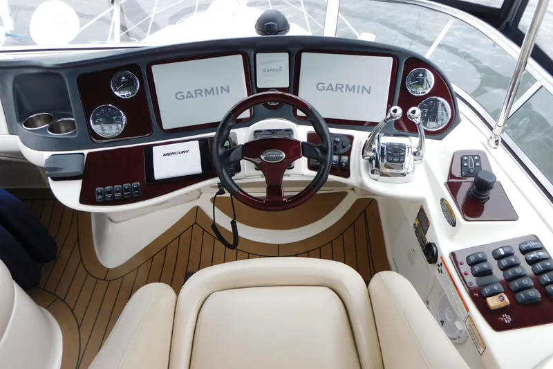 Slide: The Image of 2009 Meridian 391 Sedan helm with Garmin navigation and Mercury controls. - 15