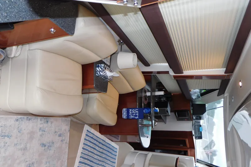 Slide: The Image of Interior of a 2009 Meridian 391 Sedan yacht with beige seating and modern amenities. - 26