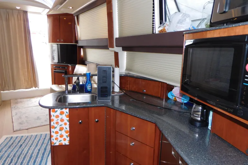 Slide: The Image of 2009 Meridian 391 Sedan yacht interior with modern kitchen amenities. - 33