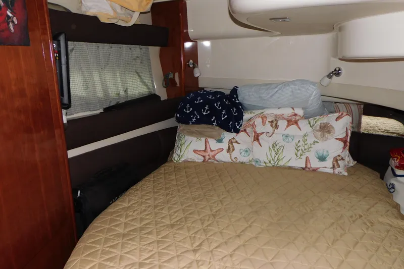 Slide: The Image of Cozy bedroom interior of 2009 Meridian 391 Sedan with nautical-themed pillows. - 36