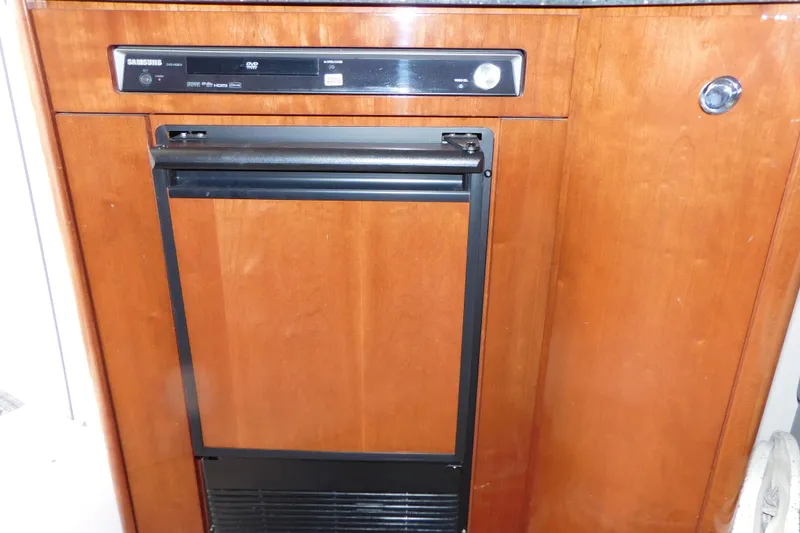 Slide: The Image of Wooden cabinet with built-in Samsung DVD player on 2009 Meridian 391 Sedan. - 39
