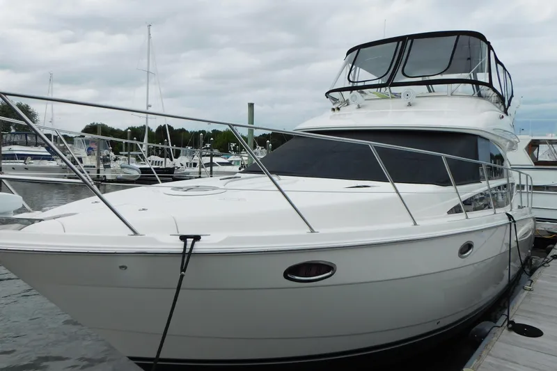 Slide: The Image of 2009 Meridian 391 Sedan yacht docked at marina under cloudy sky. - 4