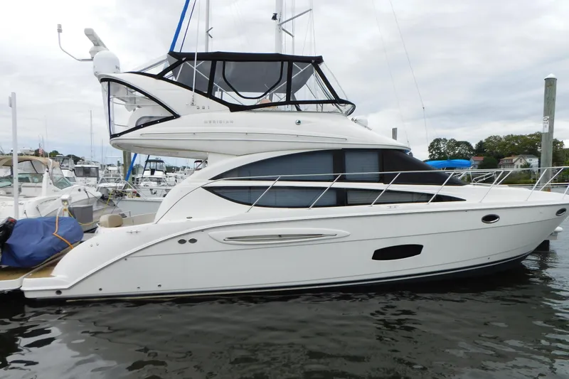 Slide: The Image of 2009 Meridian 391 Sedan yacht docked at marina, side view. - 6