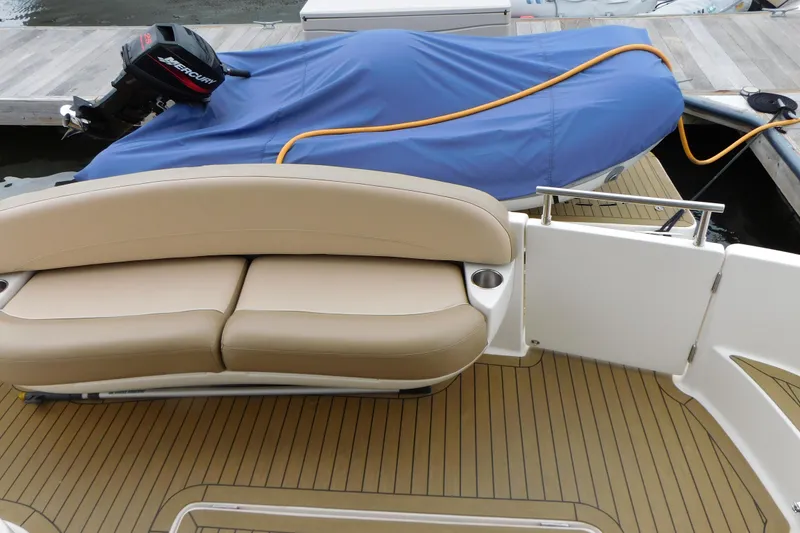 Slide: The Image of 2009 Meridian 391 Sedan boat deck with seating and covered outboard motor. - 8