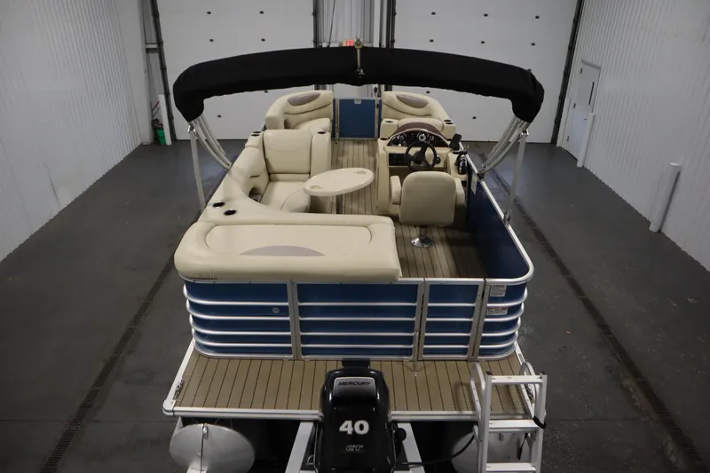 Slide: The Image of 2018 Sylvan 820 Mirage pontoon boat with beige seating and Mercury 40 HP engine. - 10