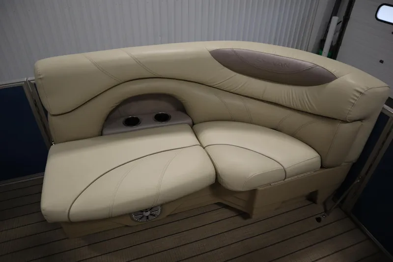 Slide: The Image of 2018 Sylvan 820 Mirage boat seating with beige upholstery and integrated cup holders. - 12