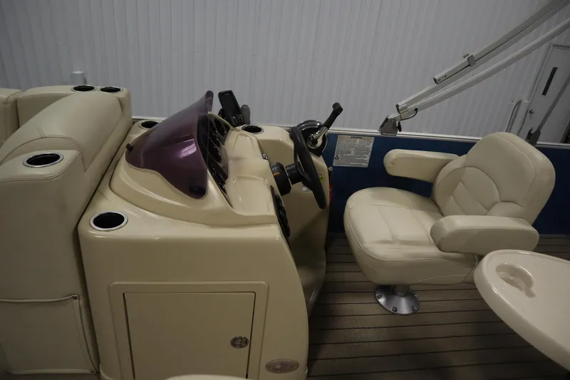 Slide: The Image of 2018 Sylvan 820 Mirage boat interior with steering console and comfortable seating. - 16