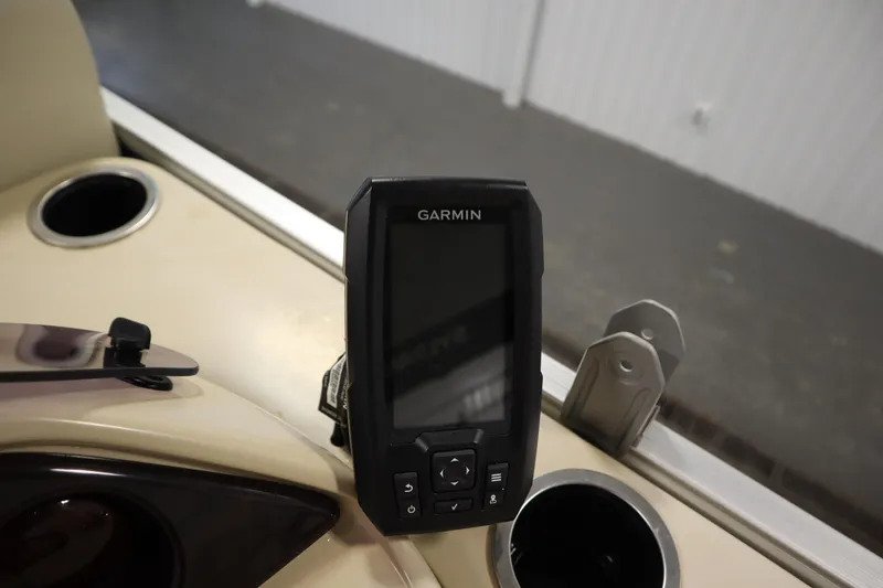 Slide: The Image of Garmin device on 2018 Sylvan 820 Mirage boat dashboard with cup holders. - 21